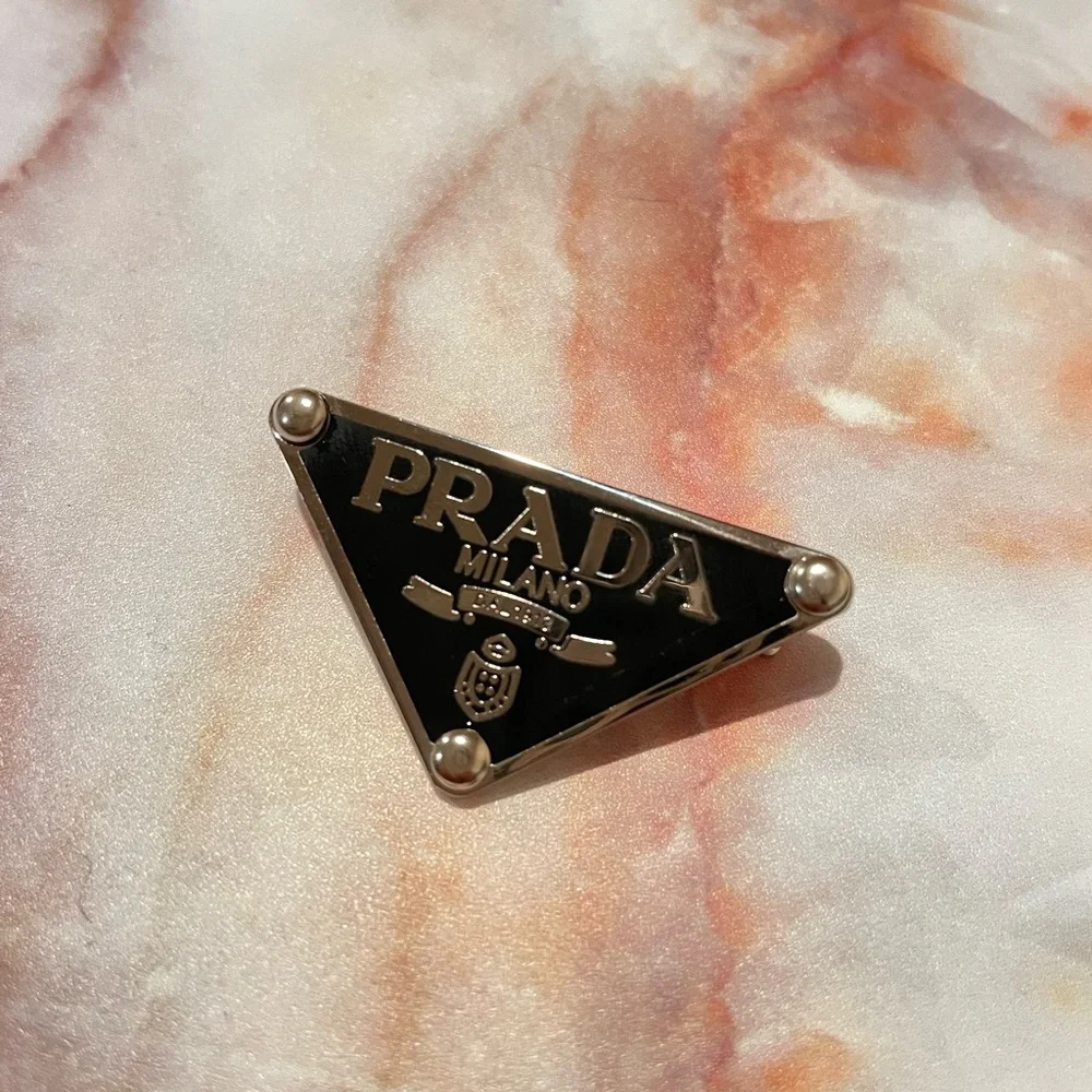 Accessories | Prada Triangle Logo Pin | Poshmark